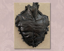 Cargar imagen en el visor de la galería, Abstract bronze wall sculpture on a cream-colored stone base, background is branded soft rose subtle patterns