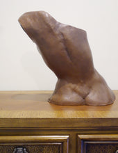 Laden Sie das Bild in den Galerie-Viewer, Terra-cotta hollow sculpture of a woman's torso sitting on a wooden dresser, back view