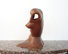 Laden Sie das Bild in den Galerie-Viewer, Terra-cotta hollow sculpture of a woman's torso sitting on a granite table, profile of breasts and artist's signature