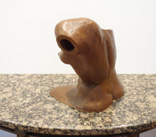 Laden Sie das Bild in den Galerie-Viewer, Terra-cotta hollow sculpture of a woman's torso sitting on a granite table, 3/4 view from back side showing art cut off