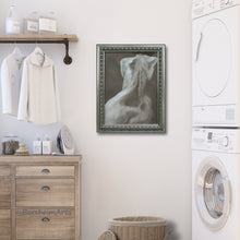 將圖片載入圖庫檢視器 Laundry room with framed monochromatic figurative artwork, wooden cabinet, and washing machine.