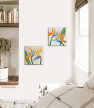 Load image into Gallery viewer, Shown in a boho style bedroom are two floral paintings of bird of paradise flowers
