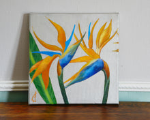 Load image into Gallery viewer, display together or individually, this images shows something of the sheen of the metallic silver background behind the bird of paradise flowers.  This is an acrylic floral painting.
