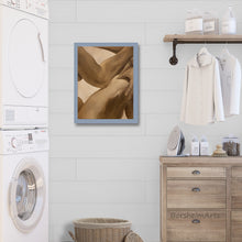 將圖片載入圖庫檢視器 Laundry room with framed abstract art, washing machines, and wooden furniture.
