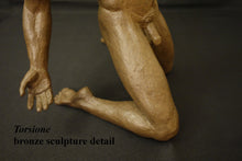 Load image into Gallery viewer, Close-up detail of a bronze sculpture depicting a kneeling male figure, with the hand reaching toward the viewer, on a dark background. Text overlay reads 'Torsione bronze sculpture detail'.