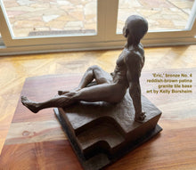 將圖片載入圖庫檢視器 View looking down on a small tabletop bronze sculpture of a seated muscular man.  His legs relax, one outstretched, the other knee bent.  His left arm is behind him, pushing him slightly forward, as if caught mid-movement.  Beautiful human figure art by Kelly Borsheim