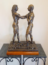 Load image into Gallery viewer, Bronze sculpture of two figures on a decorative base against a plain background