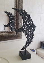 將圖片載入圖庫檢視器 This flying bird sculpture rests on a bathroom countertoop and a part of it is reflected in the large mirror behind the sink.