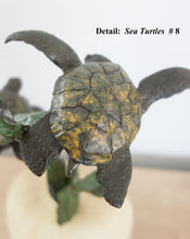 Laden Sie das Bild in den Galerie-Viewer, Detail of top sea turtles showing the yellow and green dappled patina on the shell of the bronze sculpture by Kelly Borsheim