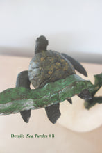 Laden Sie das Bild in den Galerie-Viewer, a sea turtle swims under a strand of green kelp in this detail image of bronze sculpture number 8 in the limited edition by Kelly Borsheim