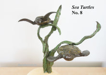 Laden Sie das Bild in den Galerie-Viewer, A bronze sculpture of two sea turtles on a twisted kelp strands, displayed on a light wood base against a plain white background. Text in the top right reads 'Sea Turtles No. 8