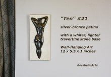 將圖片載入圖庫檢視器 Ten #21 that has a rare silvery bronze patina. She is paired with a whiter, lighter travertine stone than the typical creamier color. Enjoy this detail image of the woman's back bas-relief sculpture by Kelly Borsheim
