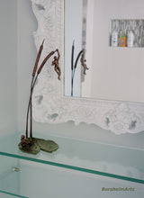 Load image into Gallery viewer, Another modern bathroom shot with the tabletop bronze sculpture of two small male figures and nature.