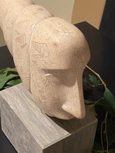 將圖片載入圖庫檢視器 Stone sculpture of a face with rattlesnake shaped fossils like hieroglyphics on a pedestal