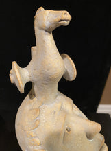 Carica l'immagine nel visualizzatore di Gallery, Ceramic portrait of a boy with a horse with wheels as a contemporary design of a wagon carrying the Trojan Horse and its hidden dangers to the boy. black background