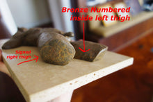 Cargar imagen en el visor de la galería, The creme tan patina shows some subtle chemical rings of color, as well as showing where the artist Kelly Borsheim signed and numbered each casting in the limited edition bronze male nude figure sculptures