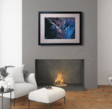 將圖片載入圖庫檢視器 Portrait of a blue angel hangs over a warm fireplace in a modern apartment of white and grey