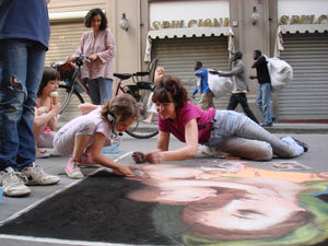Madonnara Street Painter allows children to draw with pastels for hands-on tourism.