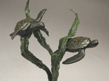 Load image into Gallery viewer, Detail of bronze sea turtles and kelp Sea Turtles seem to fly near a kelp plant. sculpture in bronze with limestone curvy hand-carved base that implies the sandy sea floor
