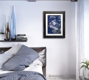 Small framed original painting of an aerial view of the Swiss Alps is paintied in blues and purples and looks perfect in this neutral and blue bedroom.  Buy for your home now.