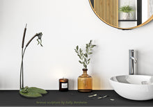 Charger l'image dans la galerie, Bronze sculpture of cattails and two frogs (one hanging from the top of the cattail while the other sits on a lily pad and watches the hanging frog, looks great in a bathroom setting