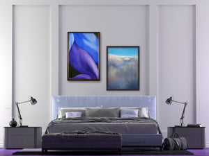 Legs in Purple and Blue is a framed original painting, hanging next to the framed pastel painting print of a cloudscape as seen from a plane.  Both artworks hang over the bachelor pad bedroom.