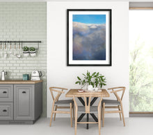 將圖片載入圖庫檢視器 a large print is classically framed with white mat and thin black frame grace this dining room that is flooded with light.