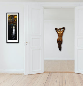 Entry way art, tall narrow framed drawing print of Florence, Italy's famous bridge, shown inside the corridor is the same artist Kelly Borsheim's bronze figure wall hanging artwork Ten.