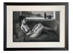 The original charcoal and white pastel drawing in its double mat and black lined frame, Daydreaming of Yesterday, a nude woman sitting on a couch lost in thought.