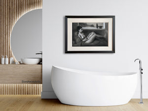 black and white drawing of a nude woman looks great in this modern bathroom, its curves contrasting with the rectangular image and frame. Daydreaming of Yesterday, perfect for lounging in this gorgeous white bathtub.