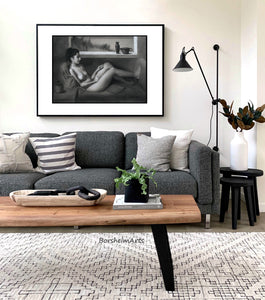 Alternative frame idea; Horizontal black and white charcoal drawing of a seated nude figure looks great over the grey couch in this living room scene... neutral home decor is relaxing.