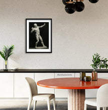 Load image into Gallery viewer, The Ecorche Archer is framed and matted in this dining room space, the black and white complimenting the room decor.
