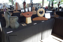 Load image into Gallery viewer, Fish Lips is shown here at a sculpture show in Little Rock, Arkansas, with two other stone carvings in the Lips Series of sculpture, Lip Service and Mobius Lips (sold)..bronze Eric is also in the image.
