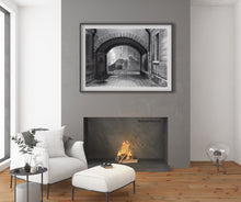 Load image into Gallery viewer, sample frame with mat in a living room with fireplace Charcoal drawing with some pastel:  A ghostly figure in the traditional Venetian black hat and cape, called the &#39;Tabarro&#39; in Italian, approaches the Ponte Canal [canal bridge] in Venezia (Venice, Italy)
