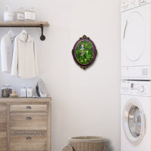 Load image into Gallery viewer, Lovely botanical painting in an oval frame adds an elegant touch to this laundry room.  Fumaria Officinalis by artist Kelly Borsheim, original artwork
