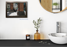 Laden Sie das Bild in den Galerie-Viewer, This 9 x 12 inch original pastel painting of a girl sitting outside reading a book in Italy adds a warm touch to this bohemian bathroom.  Art by Kelly Borsheim at BorsheimArts.com