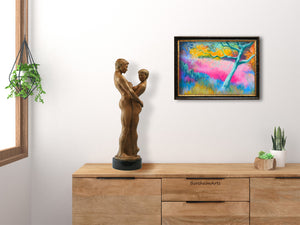 This is a mockup image of how the pastel painting on paper Mystic Olive Grove in Tuscany, Italy, might look framed on the wall of a minimalist bedroom.  On the dressertop, you see Kelly Borsheim's bronze couple sculpture titled "Together and Alone," a limited edition bronze sculpture.
