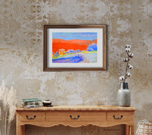 Cargar imagen en el visor de la galería, Orange Tuscan Hills pastel painting original shown in mockup of white mat and medium-toned wood frame, hung on an entryway wall over a side table of similar color wood.