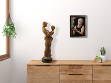 Laden Sie das Bild in den Galerie-Viewer, What a fun juxtaposition!  Bronze couple sculpture Together and Alone rests on this bedroom dressertop while this portrait of a blonde Eve looks down and away as she cups a red apple in her hands, Eve as a fated temptress.  Both artworks by artist Kelly Borsheim