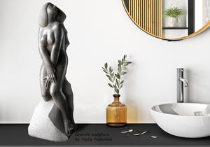 Modest and tasteful nude sculpture by Vasily Fedorouk is a statement art piece in this modern bathroom.