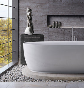 Born from Stone is a female nude stone carving in granite that looks quite as home in this luxury bathroom with a view.
