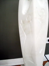 Load image into Gallery viewer, Bas relief detail in this marble flame sculpture... can you see the figure?  like primitive art, only modern art, contemporary sculpture