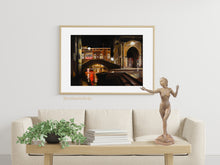 Load image into Gallery viewer, original oil painting Venezia Fish Market at Night by K. Borsheim shown here in mockup of elegant and simple living room area, and neutral decor, this painting of Venice Italy becomes statement art. Shown here with the bronze Mermaid, figure sculpture on the table in the foreground.