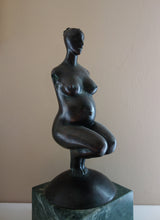 將圖片載入圖庫檢視器 woman without arms and with hair in a bun, Pregnancy, a female pregnant mamma squatting with legs together in a graceful, elegant pose, bronze figure statue, mounted on a green marble base, tabletop sculpture by Vasily Fedorouk, Ukrainian - American sculptor artist