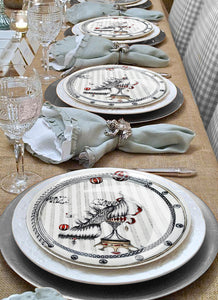 These gorgeous designer plates, the Tiger Shoe Circus by Dragana Adamov, bring a unique elegance to this table setting.