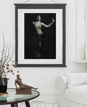 Load image into Gallery viewer, Belly dancer vertical drawing framed in this living room scene with the bronze nude male figure sculpture of Eric on the coffee table.  Both artworks are by artist Kelly Borsheim
