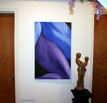 Load image into Gallery viewer, Legs, a romantic painting in blue and purple hangs above the bronze sculpture of a couple who are both Together and Alone, shown in the artist&#39;s studio in Texas
