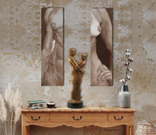 Load image into Gallery viewer, Neutral art decor, couple art bronze Together and Alone is displayed on a lovely wooden sideboard table, situated between the nude torso paintings Lui and Lei
