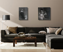 Load image into Gallery viewer, Zebra Lips makes a cool tabletop sculpture, its black and white zebra marble creating a balance with the zebra pillows on the dark grey couch; The diptich Luminosity is shown above on the wall.
