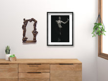 Carica l'immagine nel visualizzatore di Gallery, Oh Boy! Bronze Mirror of Nude Men shown next to art print by Kelly Borsheim over a dresser of wood color